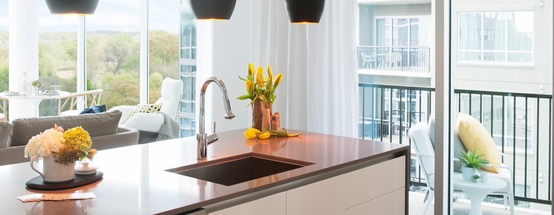 Modern pendant lighting and kitchen islands in apartments at The Registry on the Park